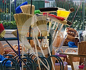 Brooms and wickerwork at an outdoor commercial fair