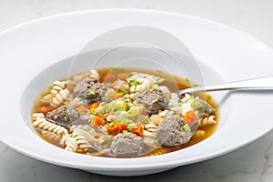 broth with liver dumplings, carrot and pasta