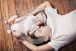 Brother hugging his newborn sister. View from above