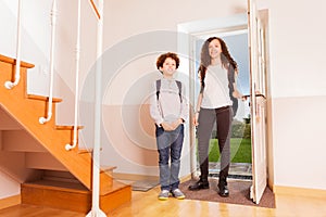 Brother and sister arriving home after school