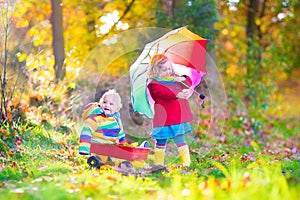 Brother and sister in an autumn park