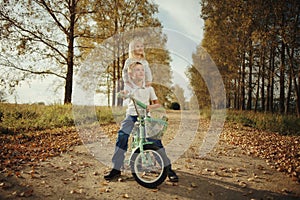 Brother and sister at autumn road photo