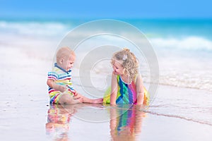 Brother and sister on a beach