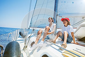 Brother and sister on board of sailing yacht on summer cruise. Travel adventure, yachting with child on family vacation.