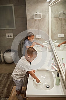 Brother and Sister Brushing Teeth