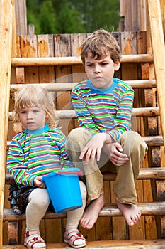 Brother and sister on children's playground