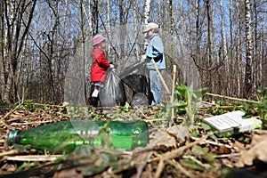 Brother and sister collect last year trash