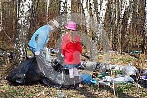 Brother and sister collect last year trash