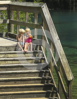 Brother and Sister Contemplate Water Entry