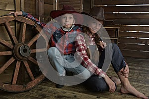 Brother and sister in cowboy hats