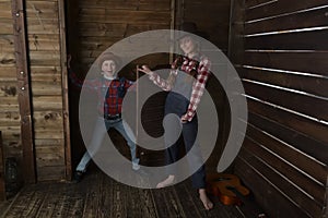 Brother and sister in cowboy hats