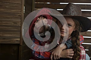 Brother and sister in cowboy hats