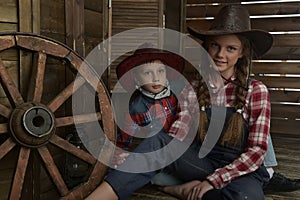 Brother and sister in cowboy hats