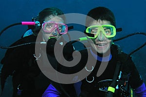 Brother and sister divers underwater