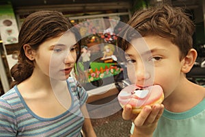 Brother and sister with doughnut