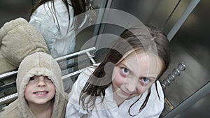 Brother and sister in elevator