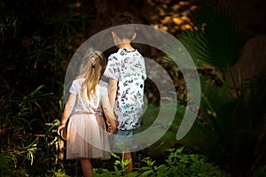 Brother and sister in a fairy forest