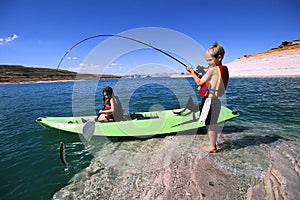 Brother and Sister Fishing and Kayaking