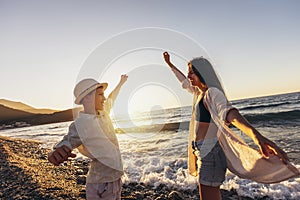 Brother and sister are having fun on the beach.