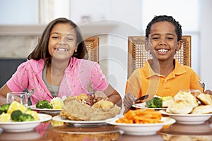 Brother And Sister Having Lunch At Home