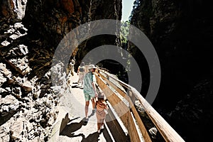 Brother with sister hikking in Liechtensteinklamm or Liechtenstein Gorge, Austria