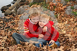 Brother and Sister Hugging at the Park