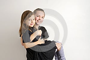 Brother and sister kids having fun, white background