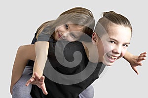 Brother and sister kids having fun, white background