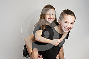 Brother and sister kids having fun, white background