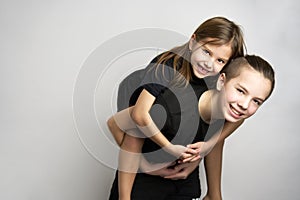 Brother and sister kids having fun, white background