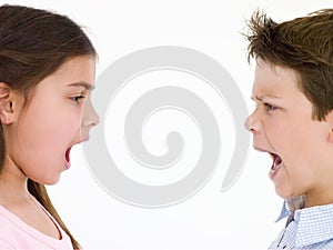 Brother and sister looking at each other shouting