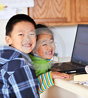 Brother and sister with notebook