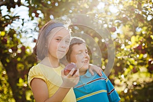 Brother and sister in an orchard