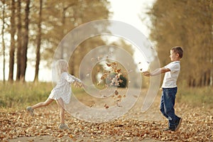 Brother and sister playin at country road