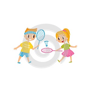 Brother and sister playing badminton. Two cheerful friends. Little boy and girl having fun together. Outdoor activity