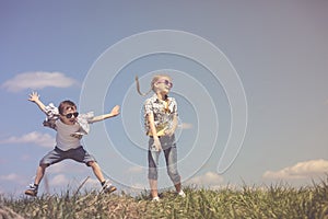 Brother and sister playing on the field