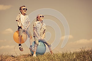 Brother and sister playing on the field