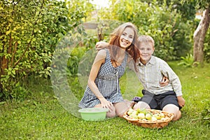 Brother and sister playing in a garden