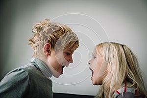 Brother and sister shout, concept of rivalry, dispute, anger, disagreement