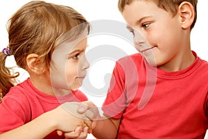 Brother and sister with smile shake hands photo