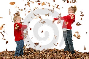 Brother and Sister Throwing Leaves