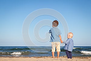 Brother and sister on walk near sea