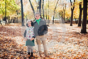 Brother and sister walking in an autumn Park.