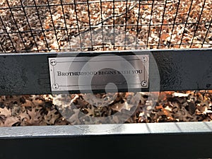 Brotherhood begins with you - inscription on Central Park bench plaque