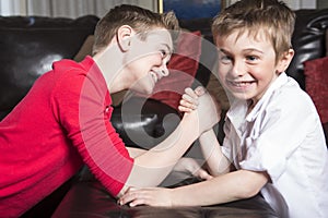 Brothers compete in arm wrestling