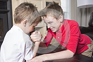 Brothers compete in arm wrestling