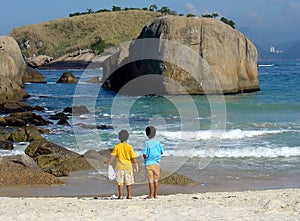 Brothers in contemplation at the beach photo