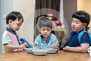 The brothers are enjoying their favorite omelet before going to school