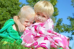Brothers Hugging in Beach Towels