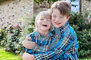 Brothers in Matching Plaid Shirts Laughing